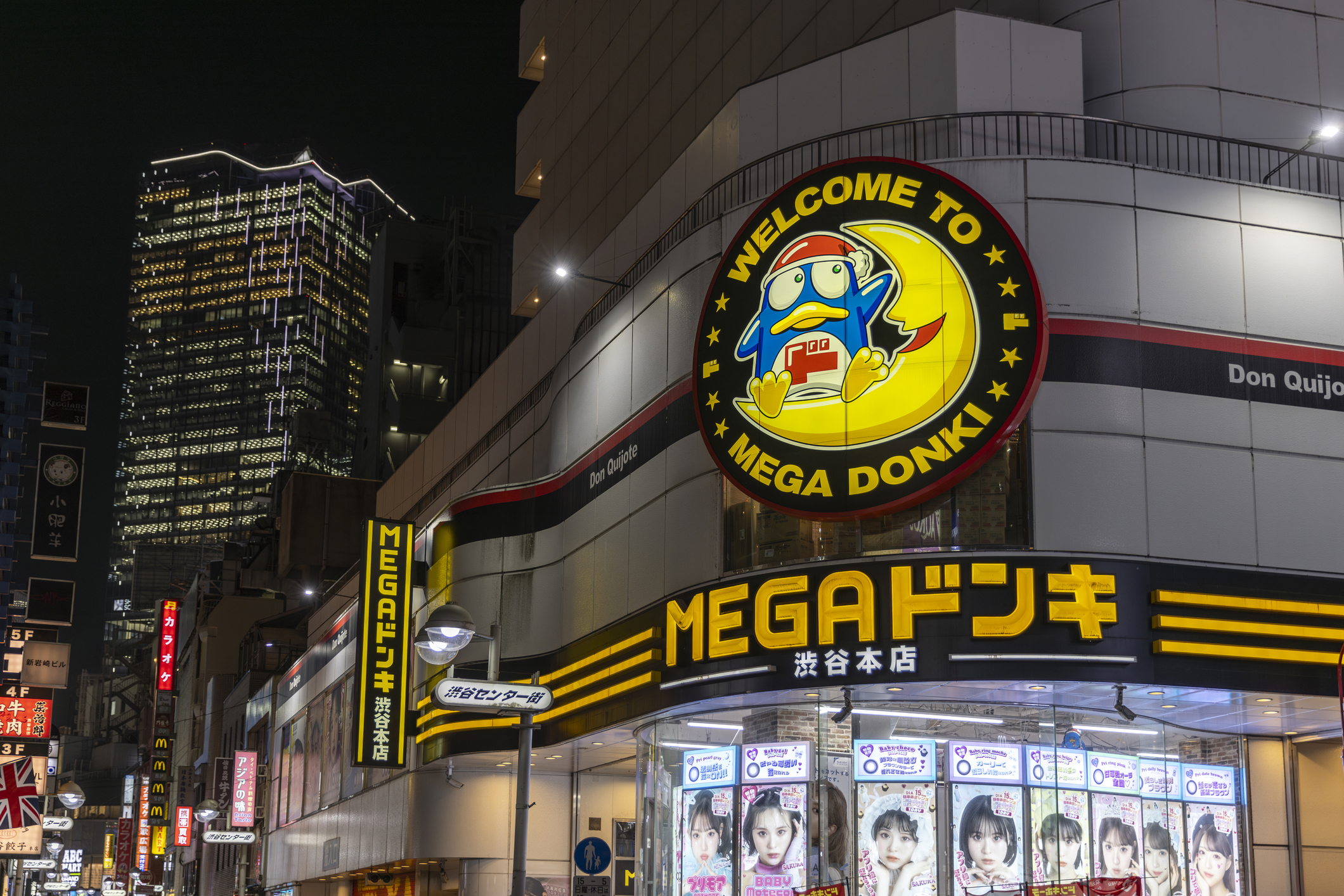 MEGA Don Quijote (Donki) store in Shibuya at night with its penguin mascot sign