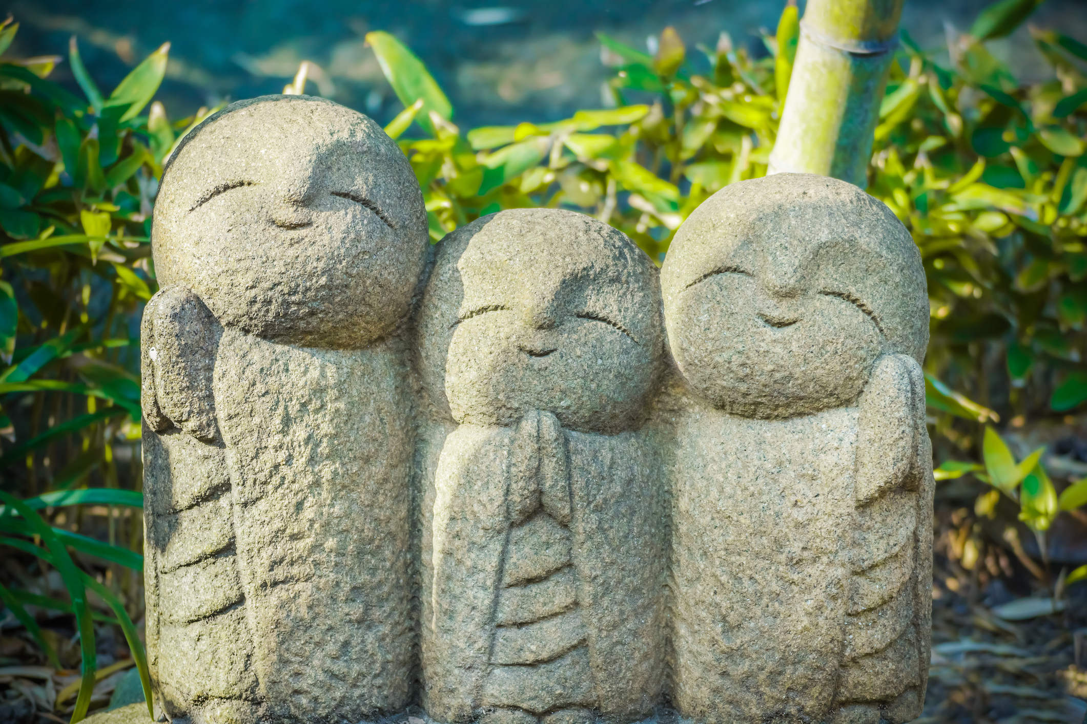 Smiling Jizo statues at Hasedera Temple in Kamakura—symbols of protection and kindness that reflect who we are, our mission, and the heart of Deep Japan.