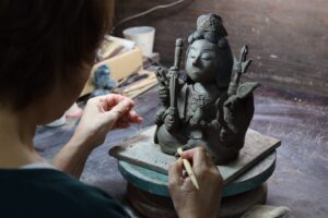 Junko making a figurine