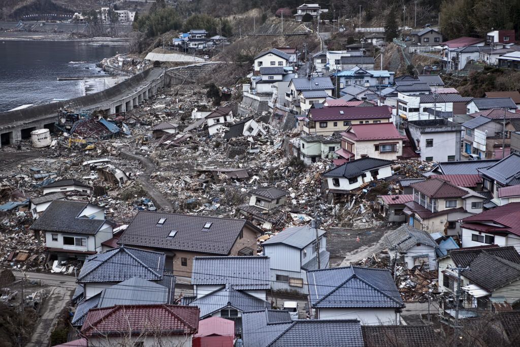 Building beyond disaster: What the people of Tohoku can teach the world 2 View of coastal houses in Tohoku after being engulfed by the tsunami during the 2011 Great East Japan Earthquake, offering a glimpse into the vast scale of devastation across the region.